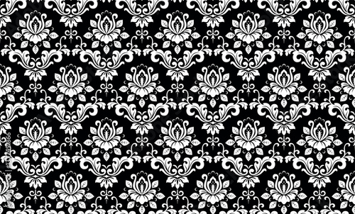 Wallpaper in the style of Baroque. White and black floral ornament. Seamless vector background. Graphic pattern for fabric, wallpaper, packaging. Ornate Damask flower illustration.
