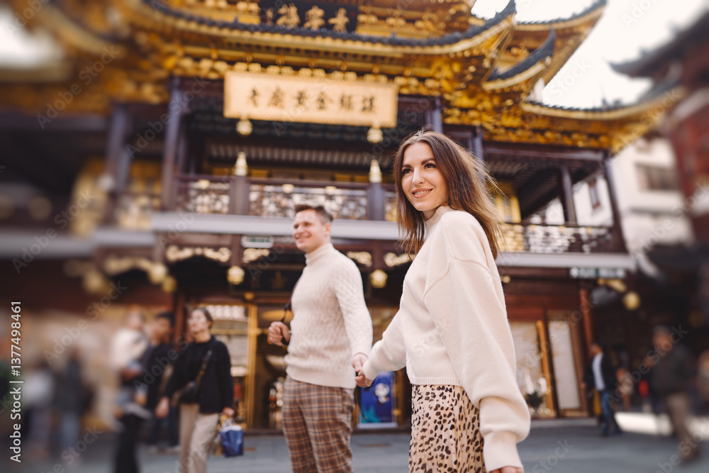 newlywed couple showing affection and holding hands in Shanghai near Yuyuan while visiting China