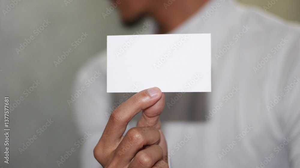 photo of blank white card in hand photo of blank white card in hand