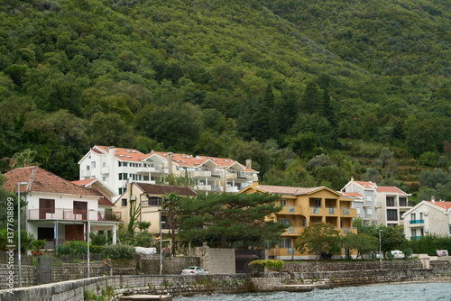 Seaside village near scenic mountain range