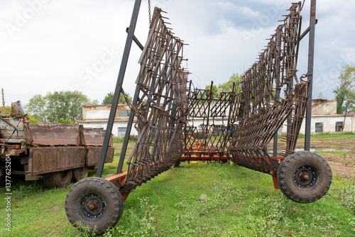Tooth harrow (Double row tooth harrow hitch) waiting for work
