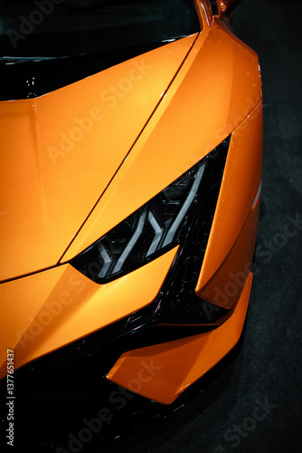 Headight of a orange car. Luxury car.