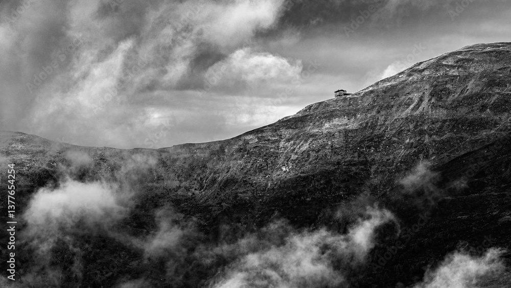 Isolated Mountain Hut in Misty High Alps – Black and White Landscape Isolated Mountain Hut in Misty High Alps – Black and White Landscape