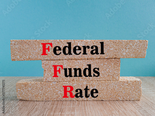 Obraz na płótnie FEDERAL FUNDS RATE symbol. Brick blocks with words FEDERAL FUNDS RATE on wooden table. Blue background. Business concept. w salonie