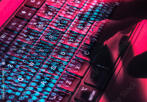 Hands typing on a laptop keyboard with digital overlay representing cybersecurity and cyber crime