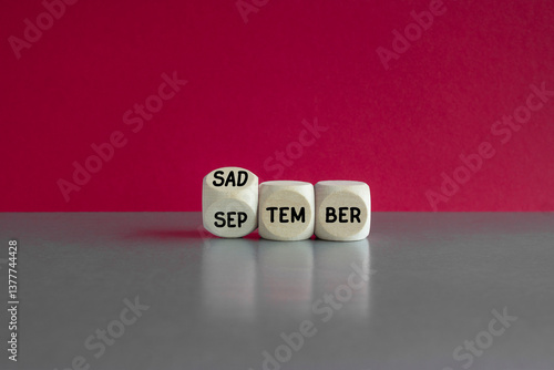 Obraz na płótnie Concept words September is Sadtember on wooden cubes. Beautiful red background, gray table. Business September is Sadtember concept. w salonie