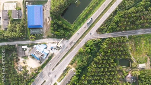 Aerial View of Highway Intersection Tranquil Blend of Urban and Nature with Greenery, Water, and Roads in Scenic Landscape