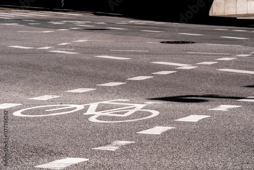 Bike lane detail on smooth asphalt in Ørestad, Copenhagen. Clean markings, directional flow and strong geometry for city infrastructure and urban planning themes.