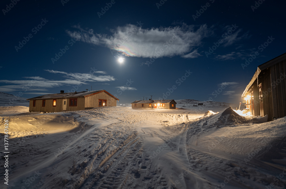 Full moon over Helags Mountain station in Jämtland, Sweden, during a cold and windy night in March.