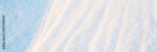 Obraz na płótnie Wide panoramic winter background with snowy ground. Natural snow texture. Wind sculpted patterns on snow surface. w salonie