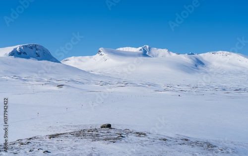 Obraz na płótnie Cross-country skiing trail and the Sylarna mountain range on a beautiful day in winter. Sweden. w salonie
