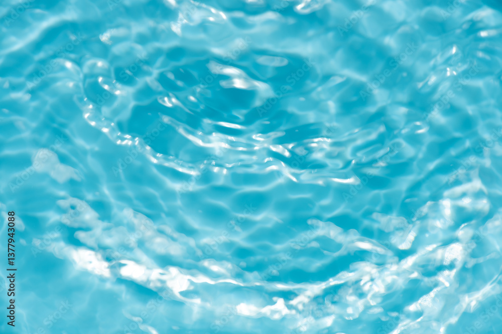 Blue water with ripples on the surface. Defocus blurred transparent blue colored clear calm water surface texture with splashes and bubbles. Water waves with shining pattern texture background. Blue water with ripples on the surface. Defocus blurred transparent blue colored clear calm water surface texture with splashes and bubbles. Water waves with shining pattern texture background.