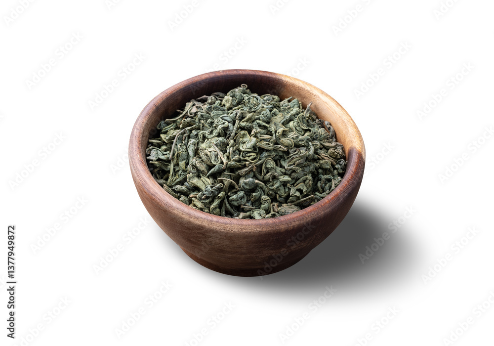 Dried green tea leaves on a bowl isolated over white background Dried green tea leaves on a bowl isolated over white background