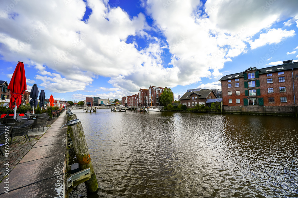 Obraz premium View of the Husumer Au in Husum on the North Frisian North Sea coast. The old town with historic buildings.