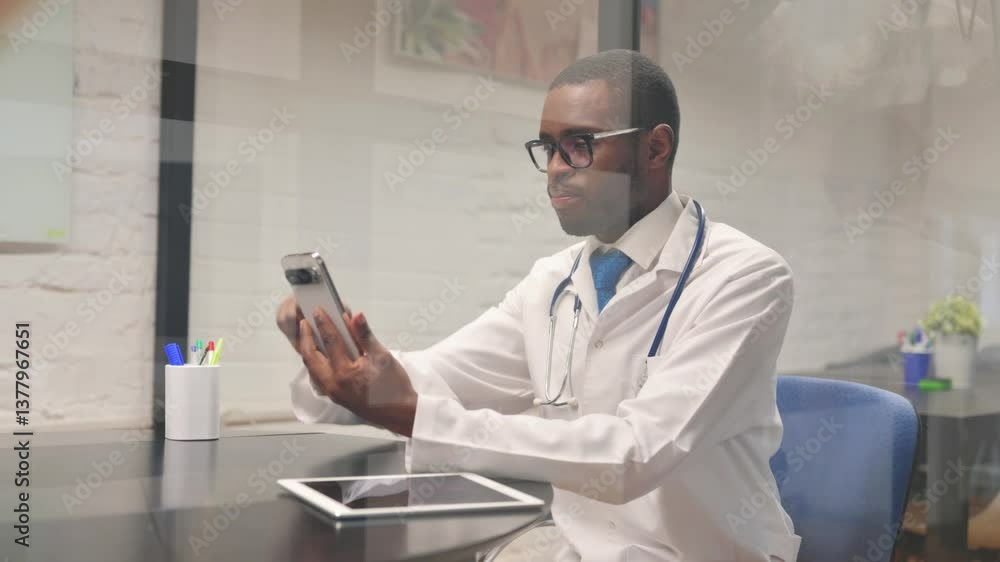 African Male Doctor Busy Using Smartphone African Male Doctor Busy Using Smartphone