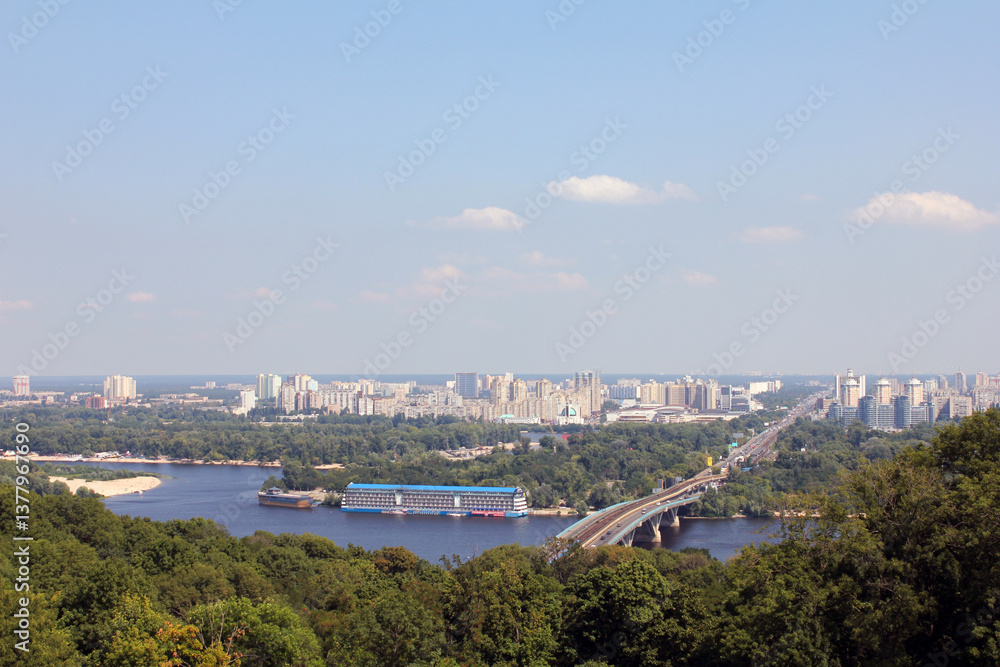 Fototapeta premium Aerial view of a city with a river and bridge