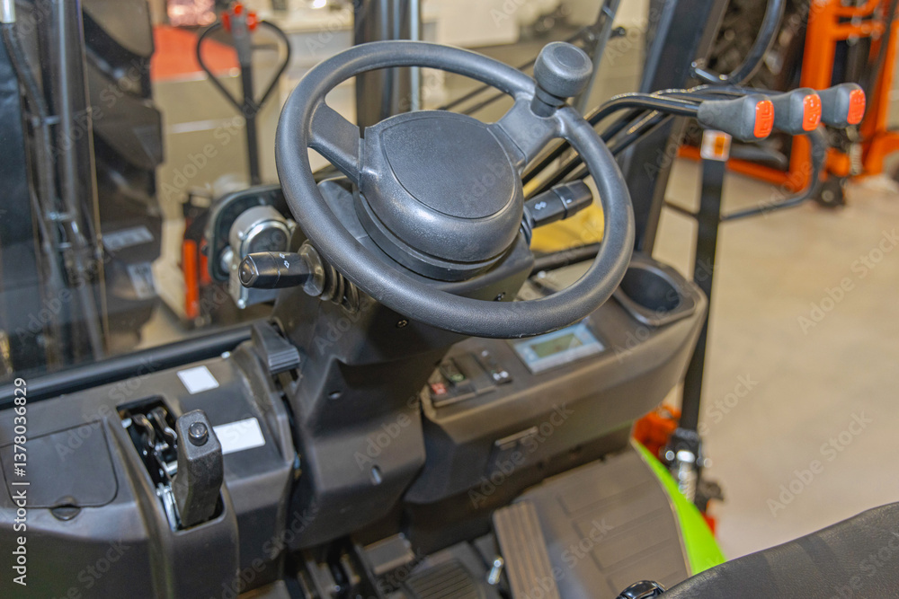 Steering Wheel With Ball and Control Levers at Forklift Truck in Warehouse