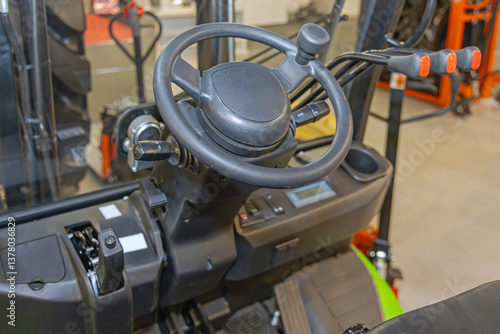 Obraz na płótnie Steering Wheel With Ball and Control Levers at Forklift Truck in Warehouse w salonie
