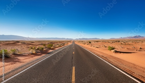 desert landscape in summer featuring clear blue sky and empty road ideal for text overlay and nature themed projects