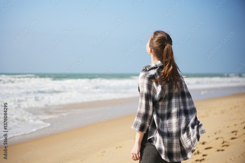 Woman enjoying peaceful moment at beach Woman enjoying peaceful moment at beach