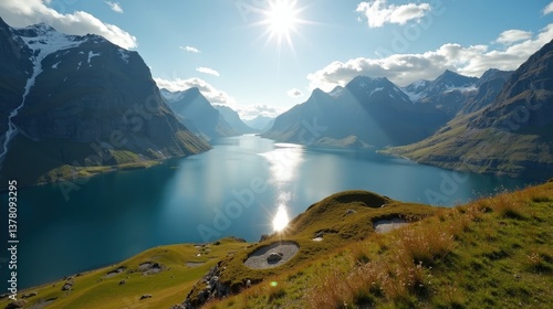 Expansive Norwegian scenery at midday, featuring sunny skies and seen from an elevated viewpoint.
