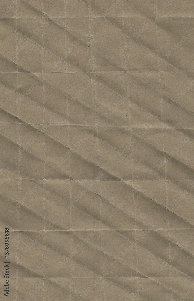 Fototapeta premium High-resolution image of folded brown paper with a diagonal and grid-like crease pattern. The natural kraft paper texture is visibly aged and rough.