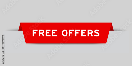 Red color inserted label with word free offers on gray background