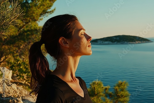 The scene features a beautiful woman on her balcony, surrounded by pinewood and the sea, as she enjoys a flawless summer holiday with a breathtaking view