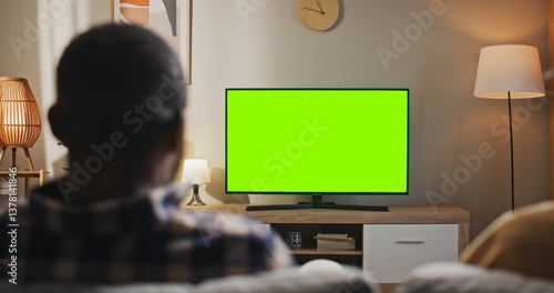 Canvas Print African American man sitting at couch