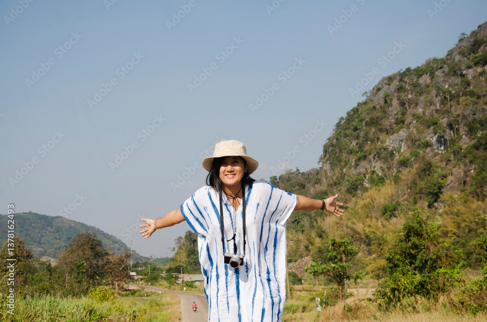 Thai women people travel and posing on the road go to Suan Hin Pha Ngam or Thailand's Kunming and Phu Pa Po mountain or Fuji City Loei Thai women people travel and posing on the road go to Suan Hin Pha Ngam or Thailand's Kunming and Phu Pa Po mountain or Fuji City Loei