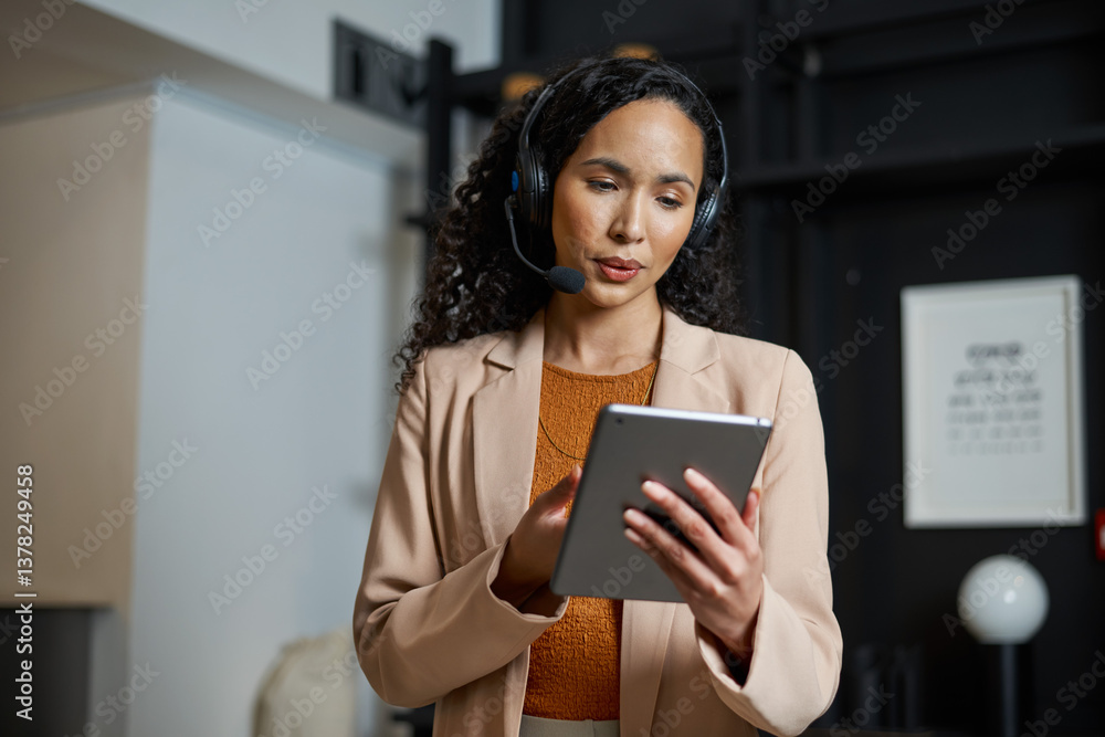 Professional Receptionist Using a Digital Tablet While Assisting Guests in a Modern Hotel Lobby Professional Receptionist Using a Digital Tablet While Assisting Guests in a Modern Hotel Lobby