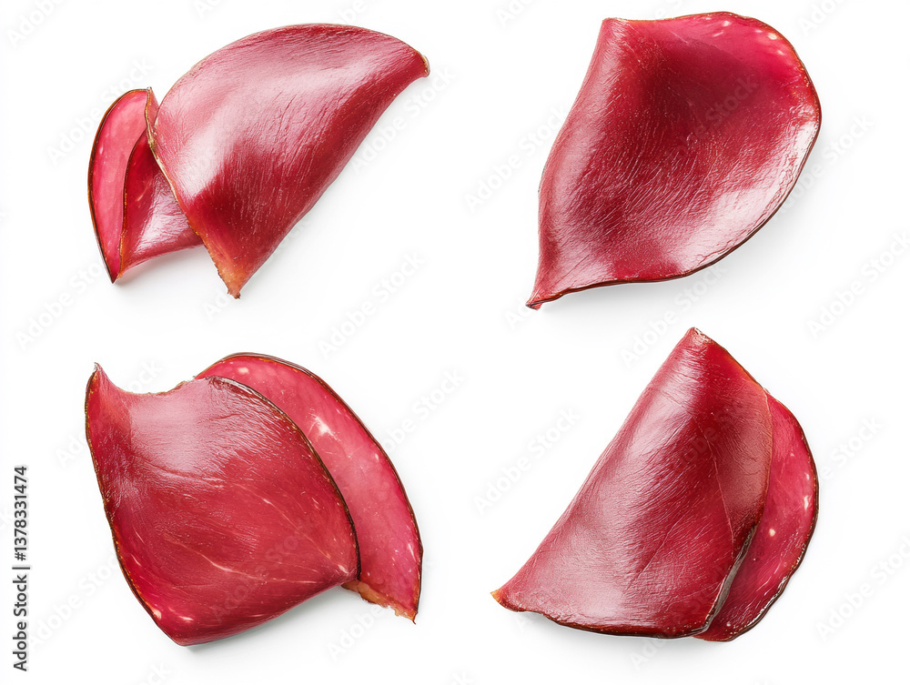 Slices of cured meat arranged on a white background Slices of cured meat arranged on a white background