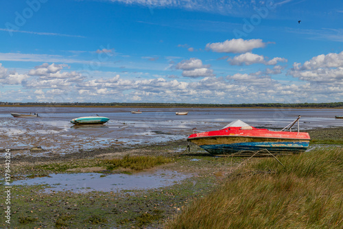 Fotografie Fishing boats on the river bank