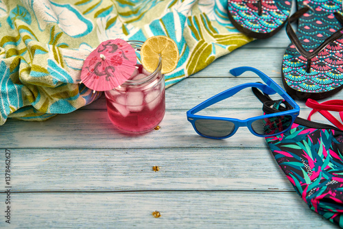 Canvas Print Flip-flops, sunglasses, bikini, sangria drink and beach towel.