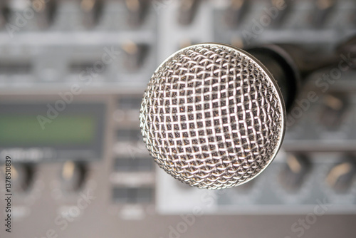 Photography Dynamic microphone against the background of a musical synthesizer