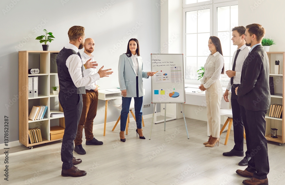 Fototapeta premium In the office setting, a businesswoman engages team in a presentation, productive conversation and collaboration among colleagues. Group meeting, teamwork and dedication to work.
