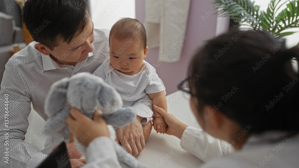 Pediatrician interacting with baby boy and father in clinic room, showcasing care and family love indoors with a focus on healthcare and patient interaction. Pediatrician interacting with baby boy and father in clinic room, showcasing care and family love indoors with a focus on healthcare and patient interaction.