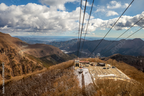 Akechidaira ropeway with surrounding beautiful viewpoints in Nikko, Japan, during cold weather in winter under cloudy blue sky