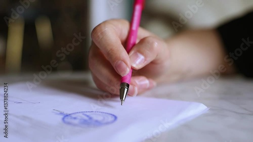 Woman signing document note close up. Selective focus.