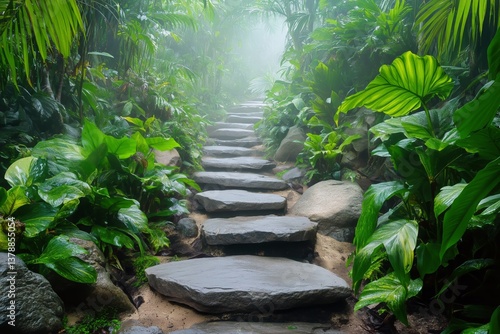 Winding Stone Path Through Dense Tropical Greenery in a Misty Forest Setting