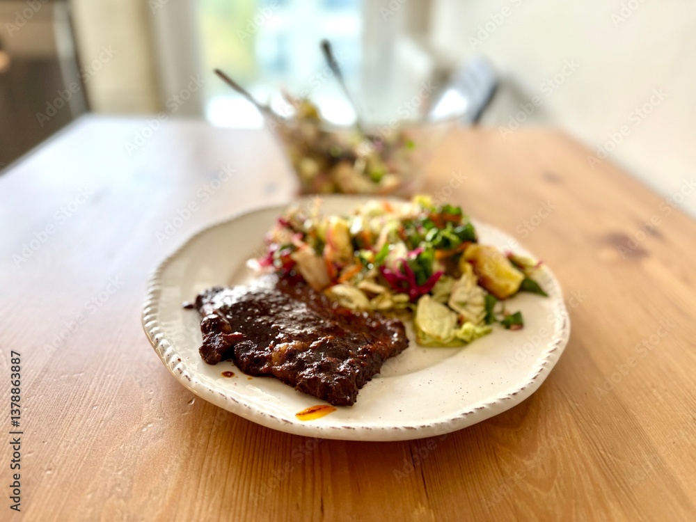 Homemade beef with tomato paste and salad on wooden table Homemade beef with tomato paste and salad on wooden table