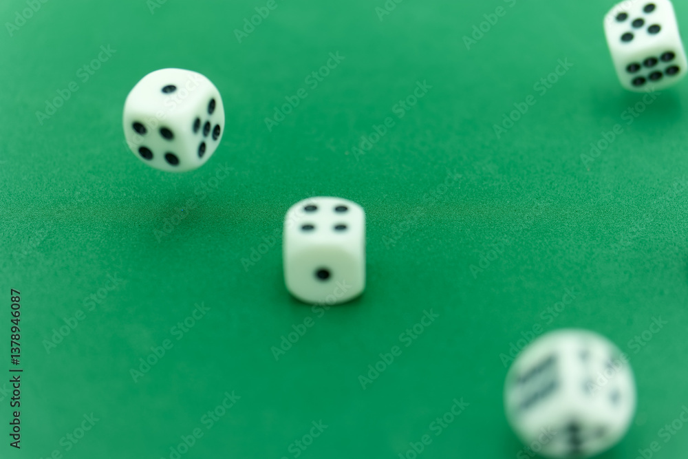 Rolling dice on a green felt surface creates excitement in a gam