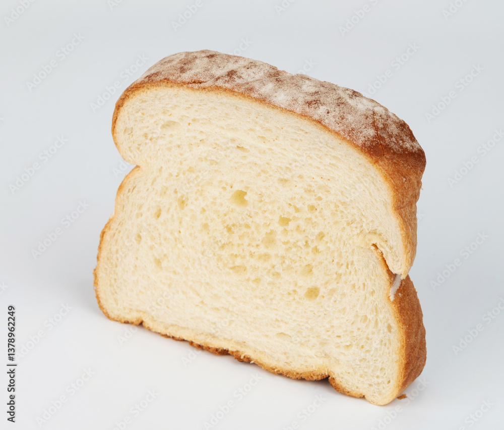 Freshly sliced white bread perfect for sandwiches or toast served on plain background Freshly sliced white bread perfect for sandwiches or toast served on plain background