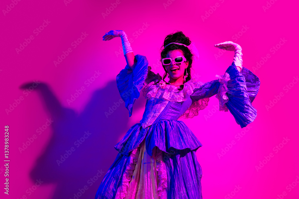 Fototapeta premium Elegant young woman in a vintage dress with a modern neon twist