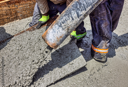 Vászonkép construction workers pouring concrete in footing trench reinforced concrete foun