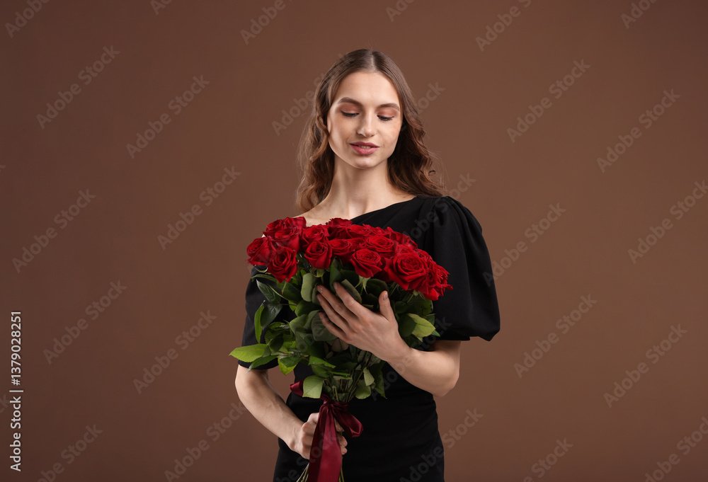 Smiling woman with bouquet of roses on brown background Smiling woman with bouquet of roses on brown background