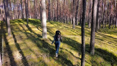 Healthy woman jogging run and workout in forest outdoor.  Latvian runner people exercise gym with fitness session, nature park background. Health and Lifestyle.