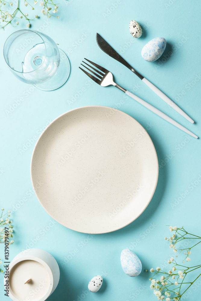 Easter table setting on blue.