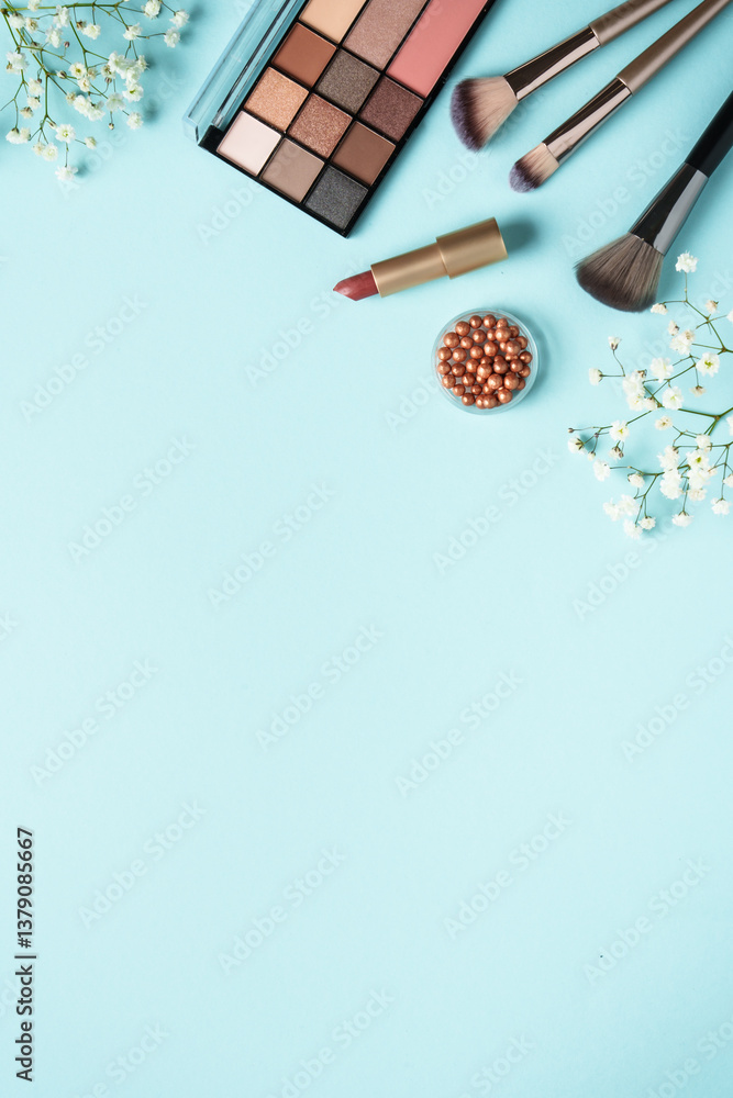Make up flat lay background on blue.
