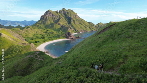 Labuan Bajo, Indonesia - 21 March 2025: Some tourists are heading to the boat from Padar Island hill
